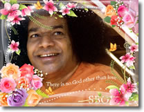Sri-Sathya-Sai-Baba-smiling-flowers-frame-photo-wallpaper