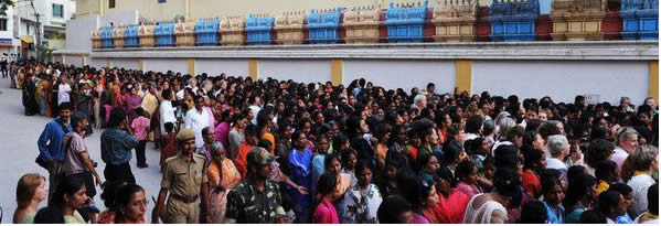 Devotees line up to see the body of  Bhagawan Sri Sathya Sai Baba during a public viewing at the Prasanthi Nilayam Ashram in Puttaparthi, India, Monday, April 25, 2011. Thousands of devotees are thronging to the ashram of Baba a day after his death.